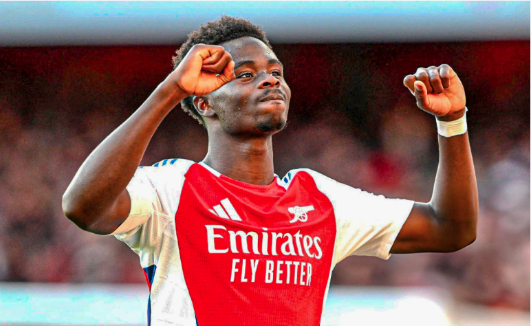 Conclusion & Legacy (200 Words) Bukayo Saka’s journey from a young boy in West London to a global football star is a story of talent, discipline, and resilience. Every aspect of his career—early life, family support, youth development, professional achievements, and international performances—paints the picture of a player destined for greatness. Saka’s legacy is being built not just on goals and assists but also on his work ethic, humility, and versatility. He is the embodiment of a modern footballer: technically gifted, tactically intelligent, and mentally strong. His rise through Arsenal’s Hale End Academy to becoming a first-team regular demonstrates the value of nurturing young talent, dedication, and perseverance. On the international stage, Saka has become a symbol of hope and creativity for England, inspiring young players worldwide. His performances at major tournaments, combined with his composure in high-pressure situations, indicate that he will be a key figure for both club and country for years to come. Ultimately, Bukayo Saka’s legacy will extend beyond statistics and trophies. It will be remembered in the way he carries himself, represents his teams, and inspires the next generation. At just 23, his journey is only beginning, and the football world eagerly anticipates the continued brilliance of this exceptional talent. XVII. FAQ Section (Optional) Q1: How old is Bukayo Saka? A: Bukayo Saka is 23 years old, born on September 5, 2001. Q2: Which teams does Bukayo Saka play for? A: He plays for Arsenal Football Club and the England national team. Q3: Who are Bukayo Saka’s parents? A: Saka’s parents are Nigerian immigrants who raised him with strong values and faith. Q4: Is Bukayo Saka married? A: No, he is currently in a private long-term relationship. Q5: How many goals has Bukayo Saka scored? A: Saka has scored consistently for both Arsenal and England, with double-digit goals in several seasons. Q6: What is Bukayo Saka’s net worth? A: His net worth is substantial due to his salary, performance bonuses, and endorsements, reflecting his growing status as a global football star. Q7: Has Bukayo Saka won any awards? A: Yes, including Arsenal Player of the Month, Young Player of the Season, and recognition in Premier League Team of the Season considerations.